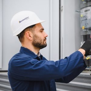 Electrical engineer approving power distribution box installation on site, Bendazzoli Impianti.